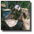 Baking pitta bread on an old oil drum